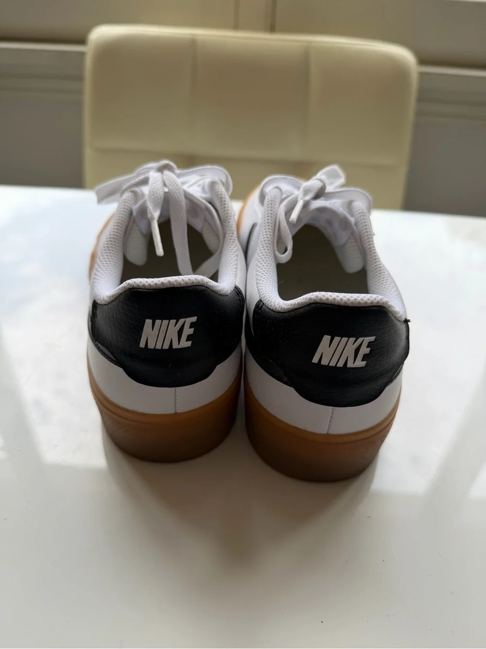 Nike White Leather Sneakers with Black Swoosh and Gum Sole